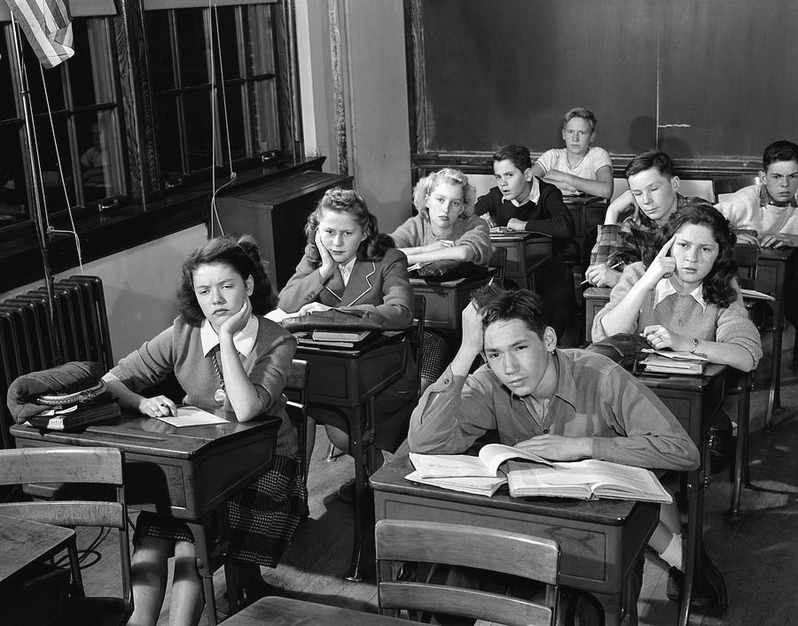 Students seated in rows facing a blackboard